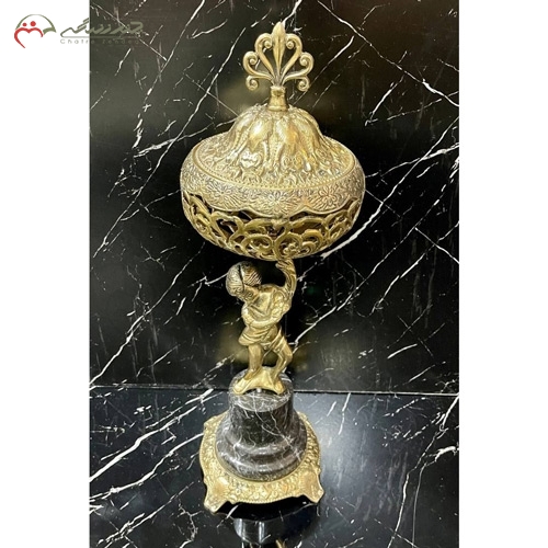خرید، قیمت و مشخصات ظرف شکلات خوری برنزی لوکس و امروزی در طرح پسرک ایستاده با پایه سنگی زیر قیمت | چترزندگی