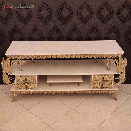 خرید، قیمت و مشخصات میز تلویزیون برنزی 4 کشو رویه هایگلس و بدنه ی طرح طاووس و گل رز برجسته با ضمانت رنگ بدنه  - چترزندگی