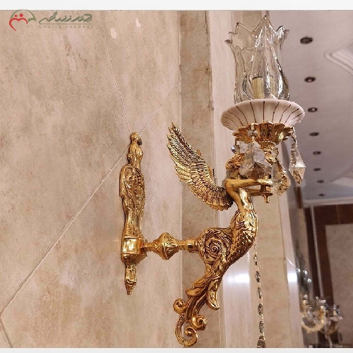 خرید، قیمت و مشخصات لوستر دیواری طرح فرشته با بدنه ی برنزی سرامیکی پر کار و آبکاری طلا با ضمانت - چترزندگی