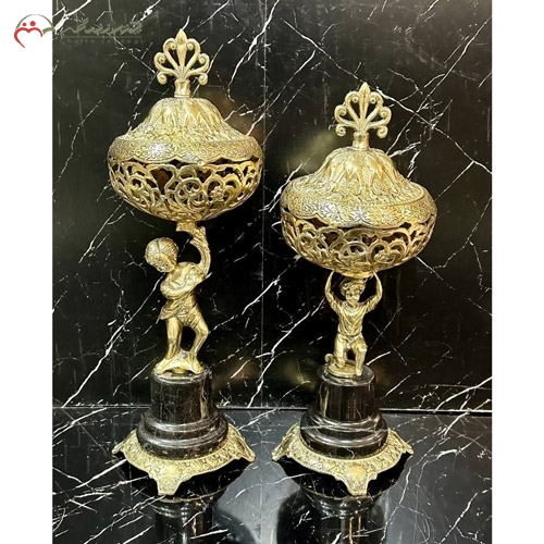 خرید، قیمت و مشخصات ظرف شکلات خوری برنزی مدرن طرح پسربچه ایستاده و پایه سنگی مشکی ارزان قیمت - چترزندگی