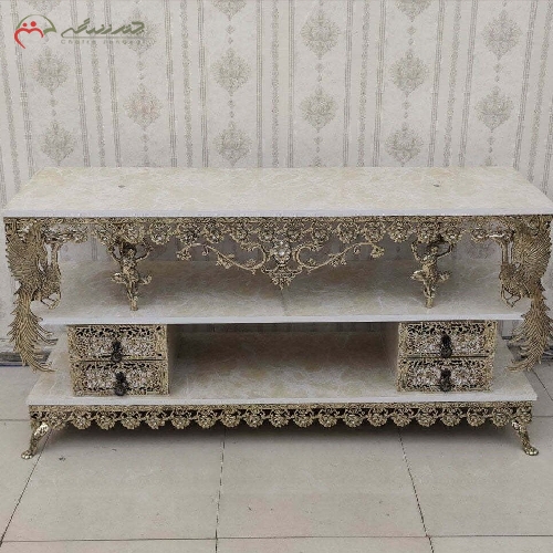 میز تلویزیون برنزی طرح طاووس و گل رز، چهار کشو با ضمانت رنگ بدنه و دوام رویه